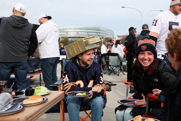 Chris Pasminski, 33, wears a cheese grater hat while tailgating before the Bears play the Green Bay Packers at Soldier Field on Sunday. (Armando L. Sanchez/Chicago Tribune)