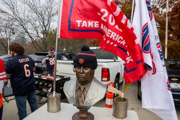 A sculpture of President-elect Donald Trump sits on a table while fans tailgate before the Bears play the Green Bay Packers at Soldier Field. (Armando L. Sanchez/Chicago Tribune)