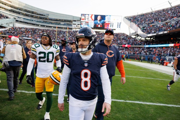 Bears place kicker Cairo Santos (8) walks off the field after his kick was blocked by Green Bay Packers defensive end Karl Brooks (94) to give the Packers a 20-19 win over the Bears at Soldier Field Sunday Nov. 17, 2024, in Chicago. (Armando L. Sanchez/Chicago Tribune)