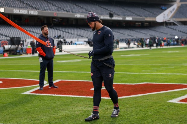 Chicago Bears quarterback Caleb Williams warms up before the Bears play the Green Bay Packers at Soldier Field. (Armando L. Sanchez/Chicago Tribune)