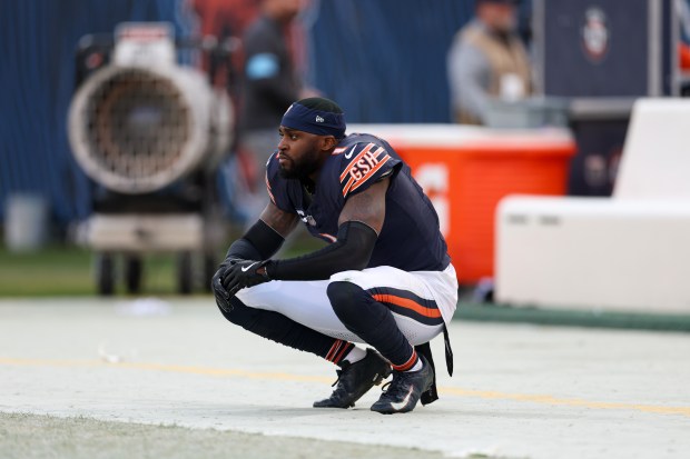 Chicago Bears cornerback Jaylon Johnson (1) kneels near the bench after the Bears lost to the Green Bay Packers, 20-19, at Soldier Field Sunday Nov. 17, 2024, in Chicago. (Armando L. Sanchez/Chicago Tribune)