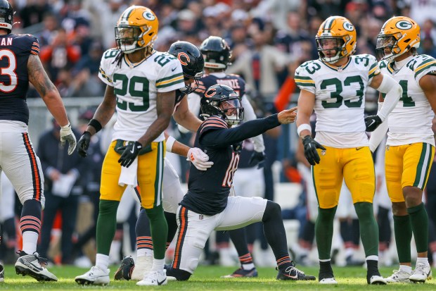 Bears quarterback Caleb Williams points after running the ball for a first down during the third quarter against the Green Bay Packers at Soldier Field Sunday Nov. 17, 2024, in Chicago. (Armando L. Sanchez/Chicago Tribune)