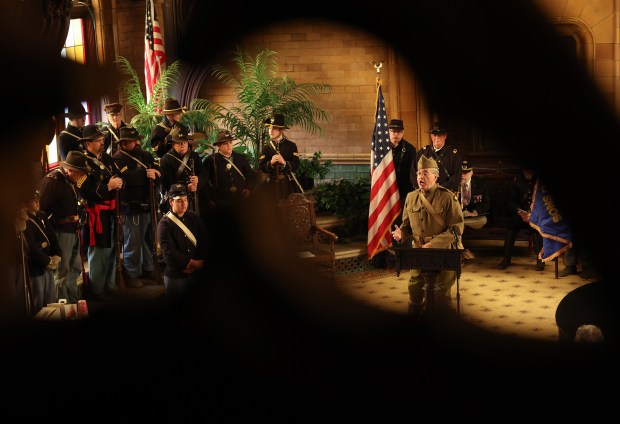 Chris Mantas reads a letter written by a World War I soldier during a Veterans Day observance and ceremony in May Chapel at Rosehill Cemetery. (John J. Kim/Chicago Tribune)