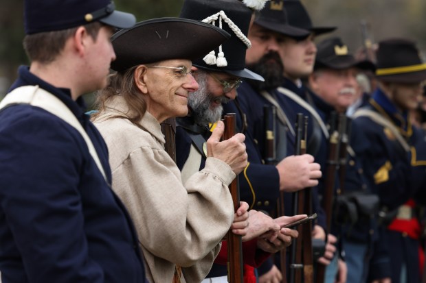 Members of the 1st Michigan Engineers Company E reenactment group stand side by side after a Veterans Day observance and ceremony at Rosehill Cemetery. (John J. Kim/Chicago Tribune)