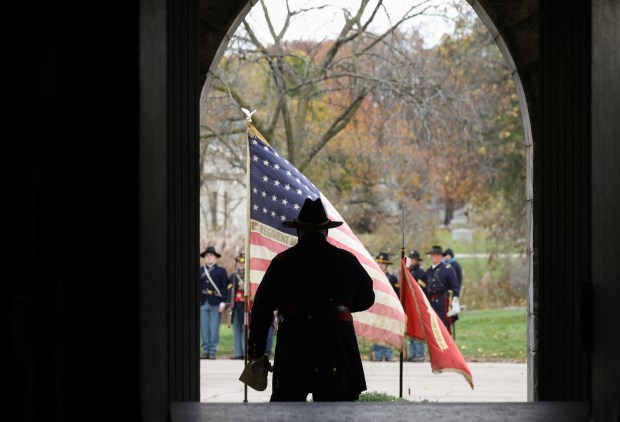 Ed McGlade of the Chicago Light Artillery Battery B reenactment group exits May Chapel after a Veterans Day observance and ceremony at Rosehill Cemetery. (John J. Kim/Chicago Tribune)