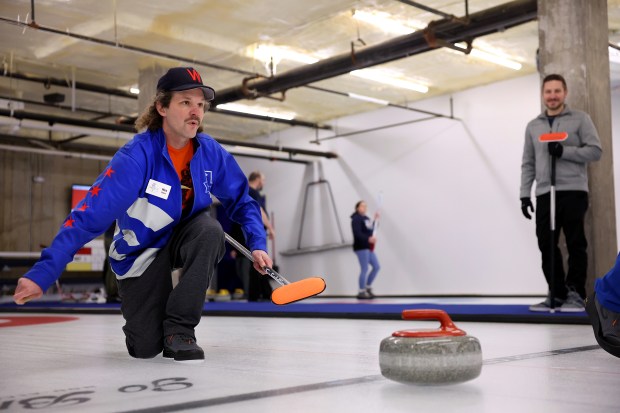 Wes Darin follows through while competing in a club league at Windy City Curling, Nov. 14, 2024. (Chris Sweda/Chicago Tribune)