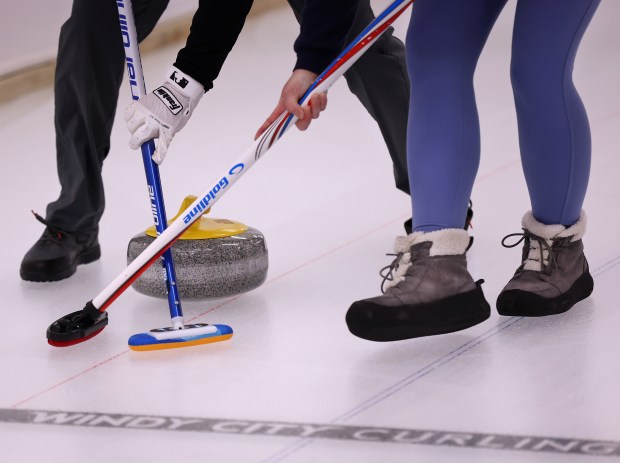 Dave King (cq) and Sarah Sekki (cq) (right) cDave King and Sarah Sekki compete iat Windy City Curling in Villa Park, Nov. 14, 2024. (Chris Sweda/Chicago Tribune)ompete in a club league at Windy City Curling in Villa Park on Thursday, Nov. 14, 2024. A fire in early March destroyed much of the curling club's facility. A reopening for the general public is set for Saturday. (Chris Sweda/Chicago Tribune)