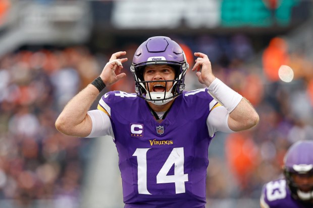 Vikings quarterback Sam Darnold directs his team during the second half against the Bears on Nov. 24, 2024. (AP Photo/Kamil Krzaczynski)