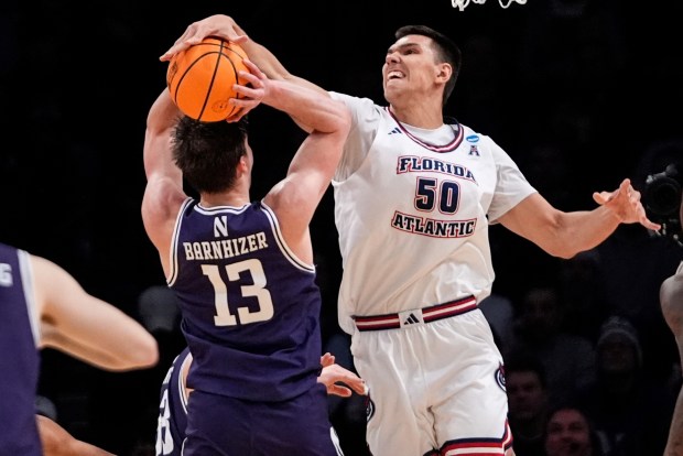 Florida Atlantic's Vladislav Goldin blocks a shot by Northwestern's Brooks Barnhizer during the first half of an NCAA Tournament game on March 22, 2024, in New York. (Frank Franklin II AP Photo)