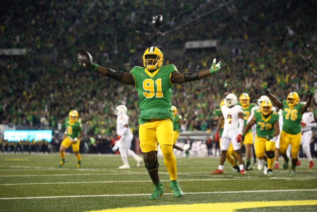 Oregon offensive lineman Gernorris Wilson celebrates his touchdown reception against Maryland on Nov. 9, 2024, in Eugene, Ore. (AP Photo/Lydia Ely)