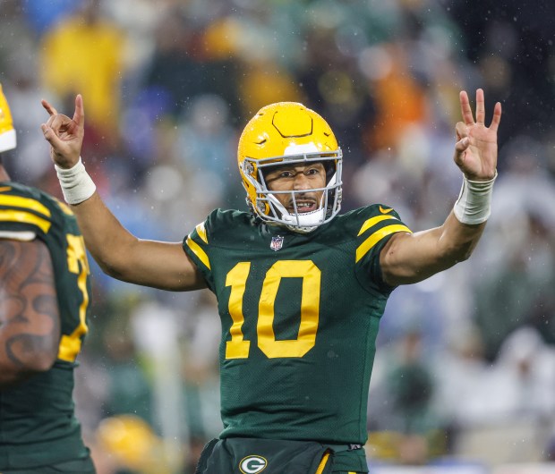 Packers quarterback Jordan Love signals during a game against the Lions on Nov. 3, 2024, in Green Bay, Wis. (AP Photo/Jeffrey Phelps)