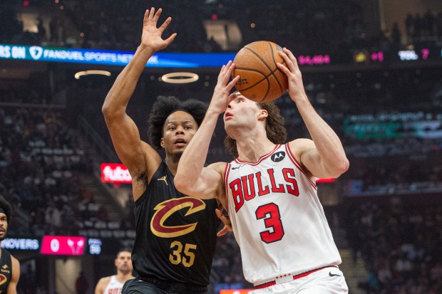 Bulls guard Josh Giddey (3) drives against the Cavaliers' Isaac Okoro during the first half on Nov 15, 2024, in Cleveland. (Phil Long/AP)