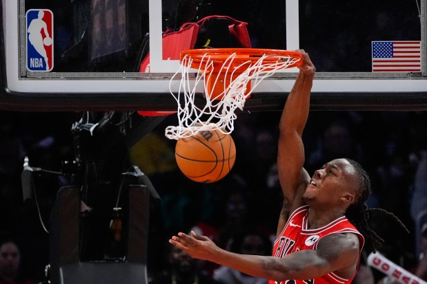 Bulls guard Ayo Dosunmu dunks during the second half against the Hawks on Nov. 9, 2024, in Atlanta. Dosunmu scored a team-high 19 points in the Bulls' 125-113 win. (John Bazemore/AP)