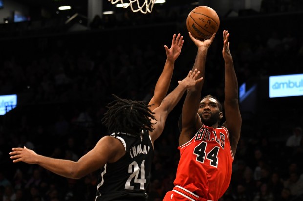 The Bulls' Patrick Williams, right, shoots against the Nets' Cam Thomas during the second half on Nov. 1, 2024, in New York. (Pamela Smith/AP)