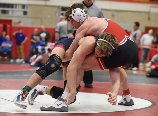 Marist's Will Denny wrestles and defeats West Aurora's Dominic Serio 15-4 at 150 pounds during the Class 3A Hinsdale Central Sectional Saturday, February 10, 2024 in Hinsdale, IL. (Steve Johnston/Daily Southtown)