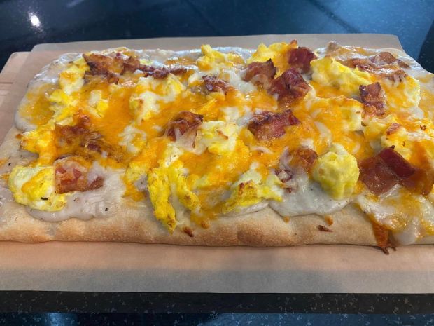 A new menu item at Eastside Café Coffee and Wine Bar's Barrington Avenue location in downtown East Dundee is the breakfast pizza, which comes with a flatbread crust, sausage gravy, scrambled eggs, mozzarella and cheddar cheeses and can be topped with bacon, sausage and/or ham. (Eastside Café Coffee and Wine Bar)