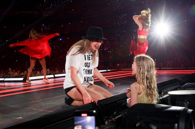 Taylor Swift greets a young fan during her concert at Lucas Oil Stadium on Nov. 1, 2024, in Indianapolis. (Kevin Mazur/Getty)