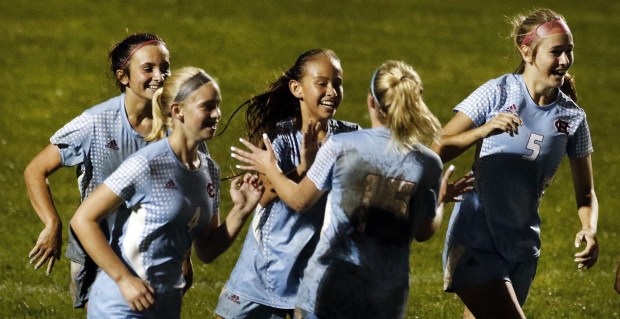 Hanover Central's Kiara Desidero, center, celebrates with teammates after she scored against West Lafayette during a Class 2A regional semifinal in Cedar Lake on Wednesday, Oct. 13, 2021.