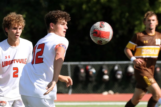 Libertyville's Henry Bownas (12), trying to control a bouncing ball, during the soccer game on Saturday, Sept. 14, 2024, in Mundelein. (Mark Ukena for the Lake County News-Sun)