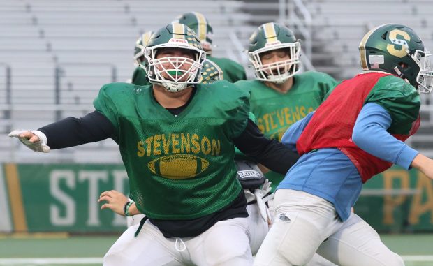 Stevenson offensive lineman Albert Murillo Jr (77) runs drills during a practice at Stevenson High School in Lincolnshire on Wednesday, Nov. 6, 2024. (Talia Sprague / News-Sun)