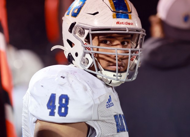 Warren's Anthony Soto watches the game on the sidelines during the Class 8A state quarterfinal football game against York in Elmhurst on Friday, Nov. 15, 2024. (James C. Svehla / for the News-Sun)