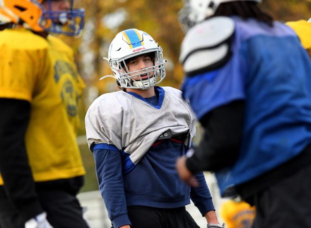 Warren's defensive tackle, Nate Brock waits as his teammates start to line up at practice. With only four days left before the Warren Blue Devils football team heads to Elmhurst to take on the York Dukes in the Class 8A quarterfinal, they intently practice at their home field in Gurnee, Wednesday, Nov. 13, 2024 (Rob Dicker / for the News-Sun)