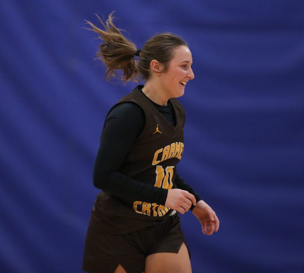 Carmel Catholic's Maia Cordova (10) runs downcourt during the Maine East Thanksgiving Tournament at Maine East High School in Park Ridge. (Talia Sprague / News-Sun)