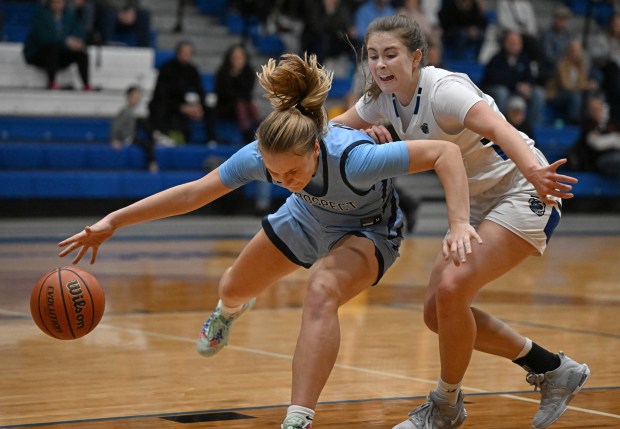 Lake Zurich's Molly Friesen, right, pressures Prospect's Alli Linke during a game in the Exam Jamm College Showcase in Lake Zurich on Tuesday, Dec. 12, 2023. (Brian O'Mahoney / News-Sun)