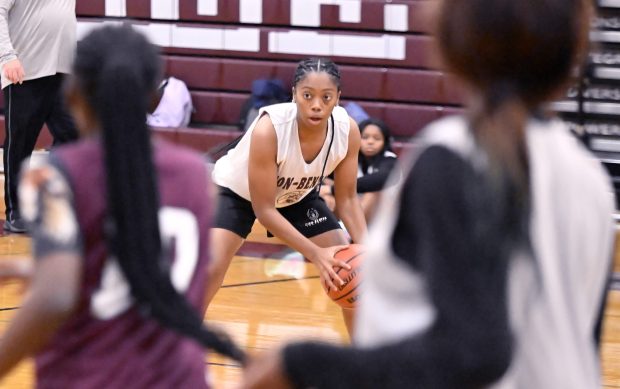 Zion's Jada Dawkins, center, looks for someone to pass to during basketball practice at Zion, on Wednesday, Nov. 20, 2024. (Michael Schmidt / for the News-Sun)