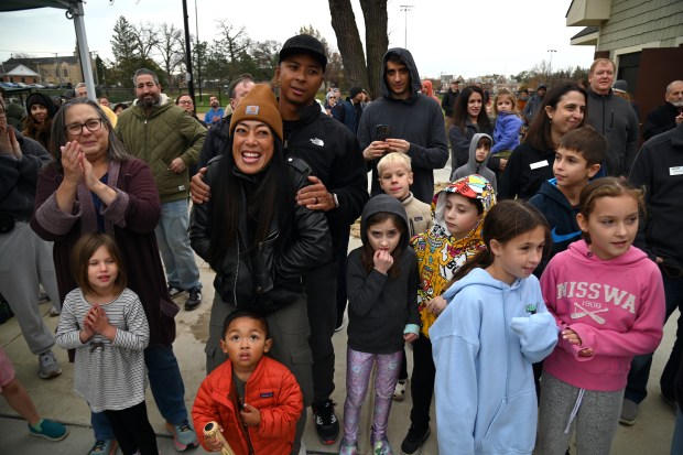 People react with enthusiasm at the ribbon cutting ceremony at the renovated Jewett Park playground on Nov. 9, 2024 in Deerfield. (Karie Angell Luc/Lake County News Sun)