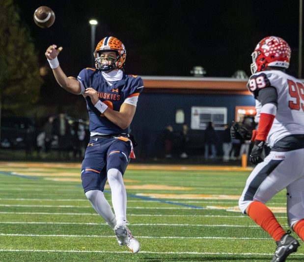 Naperville North's Jacob Bell (2) throws the ball against Maine South during a game in the first round of the Class 8A playoffs in Naperville on Saturday, Nov. 2, 2024. (Troy Stolt / for the Naperville Sun)