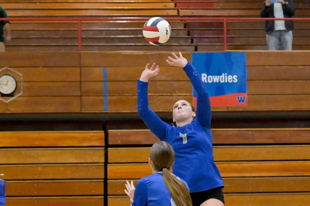 St. Charles North's Mia McCall (7) sets the ball against Benet during the Class 4A West Aurora Sectional championship match in Aurora on Thursday, Nov. 7, 2024. (Mark Black / for the Beacon-News)