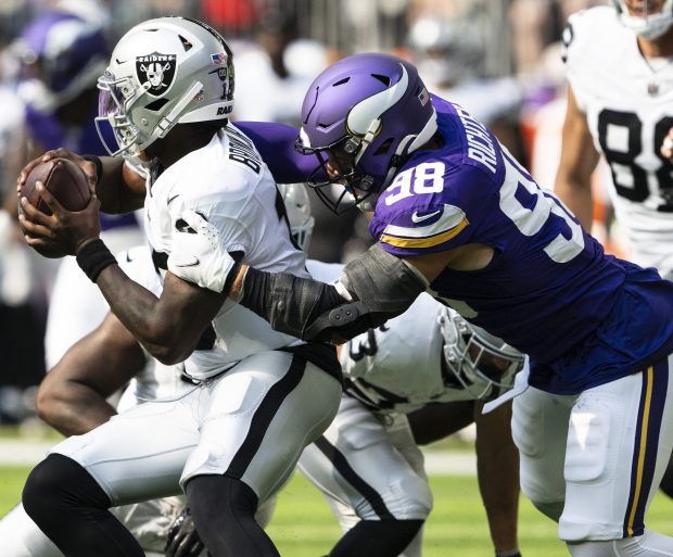 Minnesota Vikings linebacker Bo Richter (98) sacks Las Vegas Raiders quarterback Anthony Brown Jr. (13) in the third quarter of a preseason game at U.S. Bank Stadium in Minneapolis on Saturday, Aug. 10, 2024. (John Autey / Pioneer Press)