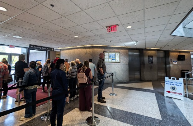 Voters wait to cast their ballots early for the Nov. 5 general election at the Naperville Muncipal Center on Wedesday, Oct. 30, 2024. (Tess Kenny/Naperville Sun)