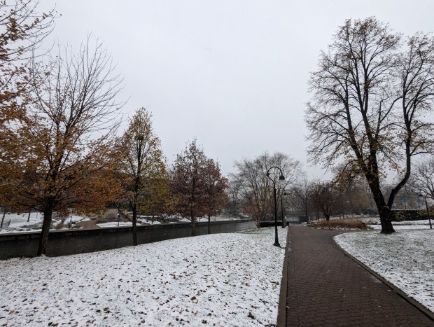 The first snow to fall in Naperville this winter season was wet and blustery, with temperatures cold enough on Thursday, Nov. 21, for it to stick to the ground and cause slippery conditions for motorists and pedestrians. (Tess Kenny/Naperville Sun)