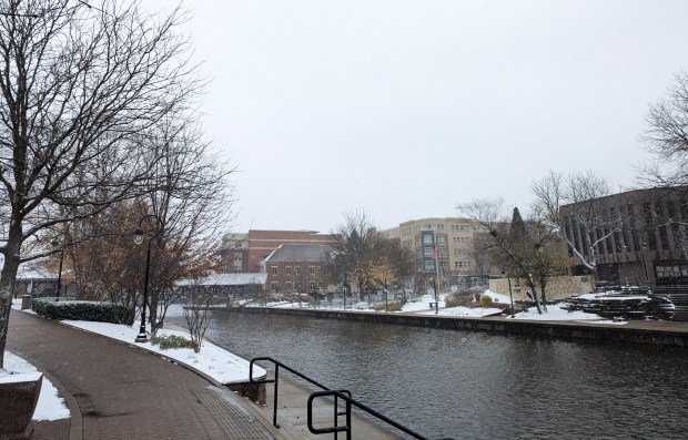 The first snow to fall in Naperville this winter season was wet and blustery, with temperatures cold enough on Thursday, Nov. 21, for it to stick to the ground and cause slippery conditions for motorists and pedestrians. (Tess Kenny/Naperville Sun)