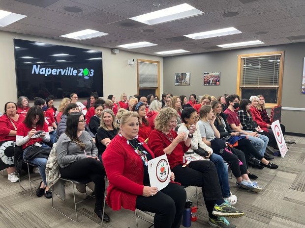 The large number of Naperville School District 203 support staff employees, parents, teachers and other supporters who attended Monday night's D203 school board meeting filled the meeting room and an overflow area. The union is angry that they've been working without a contract since June. (Michelle Mullins/Naperville Sun)