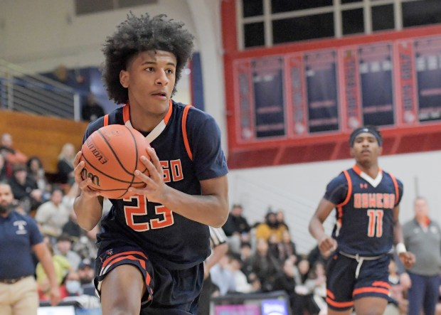 Oswego''s Dasean Patton (23) drives to the basket against West Aurora during a Southwest Prairie West game in Aurora on Tuesday, Jan. 30, 2024.