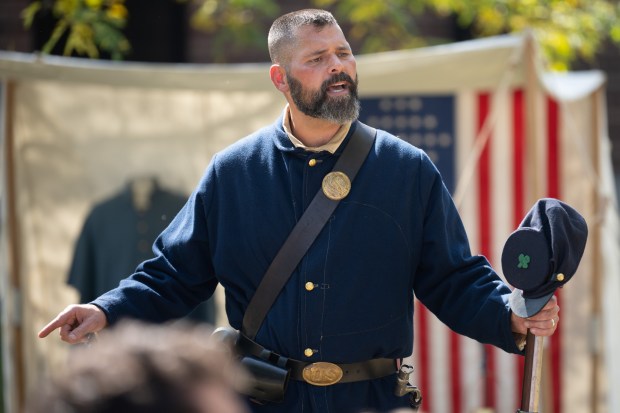 Chesterton High School history teacher Bob DeRuntz, in Union garb, performs the Gettysburg Address for students during a living history Civil War camp in the school's courtyard on Monday, September 27, 2021. (Kyle Telechan for the Post-Tribune)