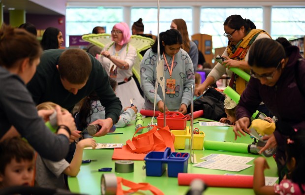 The Tooth Fairy is visible near the lightsaber craft table at the Mini Comic Con at the Vernon Area Public Library on Nov. 16, 2024 in Lincolnshire (Karie Angell Luc/Pioneer Press)