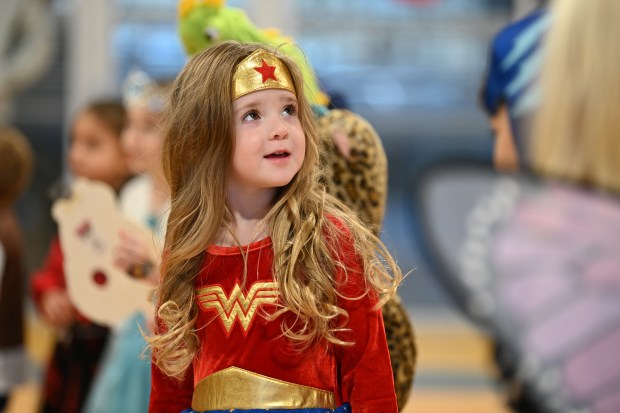 Charlotte Mumbower, 4, of Harwood Heights, is a superhero at the Harwood Heights Youth Commission Halloween Party on Oct. 26, 2024 at the Harwood Heights Recreation Center in Harwood Heights. (Karie Angell Luc/Pioneer Press)