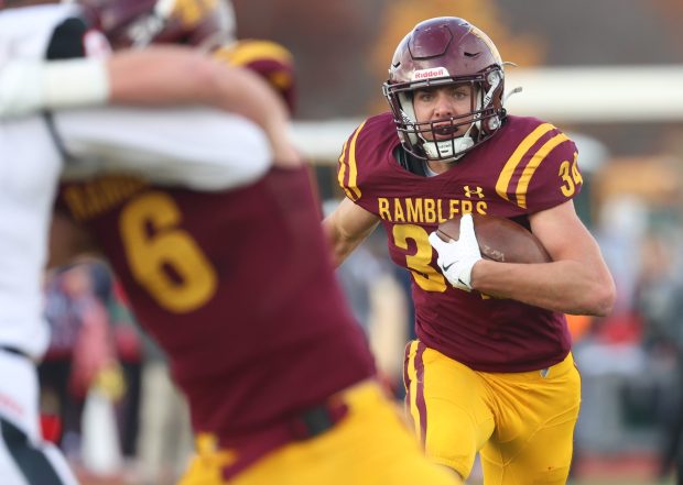 Loyola running back Drew MacPherson (34) runs for a gain against Maine South during a Class 8A state quarterfinal at Loyola Academy in Winnetka on Saturday, Nov. 16, 2024. (Talia Sprague / Pioneer Press)