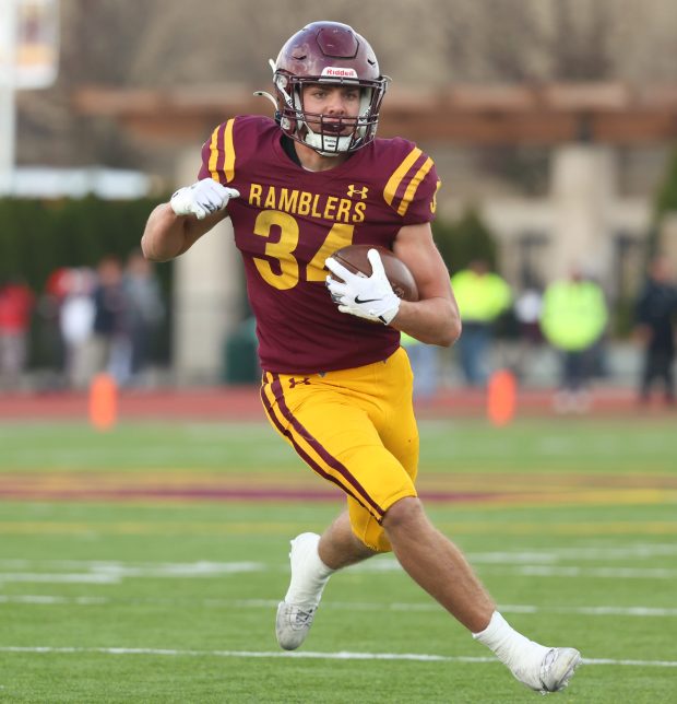 Loyola running back Drew MacPherson (34) runs for a gain against Maine South during a Class 8A state quarterfinal at Loyola Academy in Winnetka on Saturday, Nov. 16, 2024. (Talia Sprague / Pioneer Press)