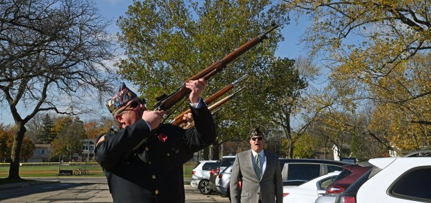 Fronting the rifle guard is Jason Peiffer of Northbrook at the Veterans Day Ceremony at Northbrook Junior High in Northbrook on Nov. 11, 2024. (Karie Angell Luc/Pioneer Press)