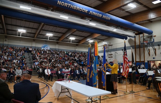 Keynote speaker Erica Borggren of Chicago, raised in McHenry, addresses the audience at the Veterans Day Ceremony at Northbrook Junior High in Northbrook on Nov. 11, 2024. (Karie Angell Luc/Pioneer Press)