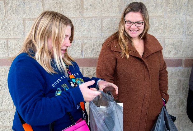 Stephanie Sorenson of Griffith, left, and her aunt, Holly Haitsma of Highland, discuss their holiday purchases on Black Friday in Highland on Friday, Nov. 29, 2024. (Michael Gard/for the Post-Tribune)