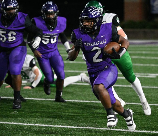 Merrillville's Jac'Quarious Johnson slips away from Valparaiso defense during the Class 5A Regional championship game on Friday, Nov. 15, 2024. (Kyle Telechan/for the Post-Tribune)