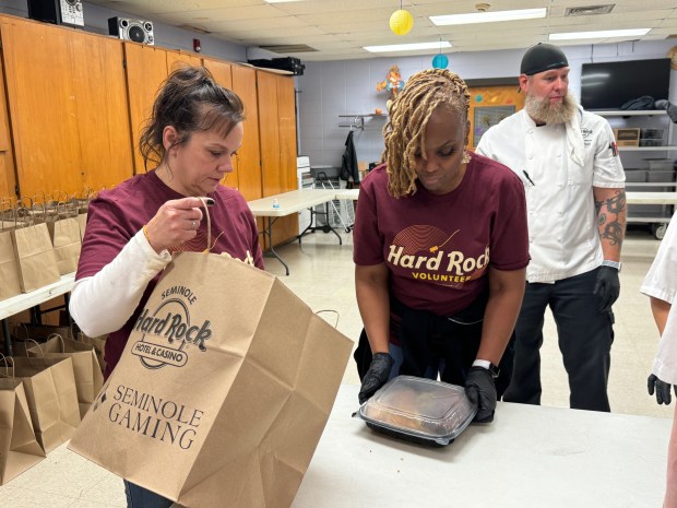 Hard Rock Casino volunteers bag up individual Thanksgiving dinners with all the trimmings for families at the Salvation Army of Lake County Gary-Merrillville Corps Community Center on Nov. 21. (Photo courtesy of the Hard Rock Casino)