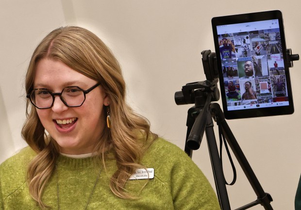 Kelley McDonnell assistant branch head librarian, laughs as she relates the various ways the library is trying to attract new patrons though TikTok at the Lake County Public Library in Merrillville on Thursday, Nov. 21, 2024. (John Smierciak / Post-Tribune)