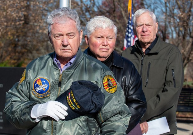 U.S. Veterans Jim Spanopoulos, Doug Pierce and Rick Staresina (left to right) pause during the playing of Taps at the Veterans Day Ceremony held in at the Service Memorial at Foundation Meadows in Valparaiso, Indiana Friday Nov. 8, 2024. All three men read the names on the Duty and Sacrifice Wall during the ceremony.(Andy Lavalley/for the Post-Tribune)